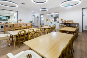 Nido Riverton Dining Area with Wooden Tables and Chairs