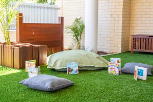 kids playing area with green grass carpet in nido child care centre at belmont